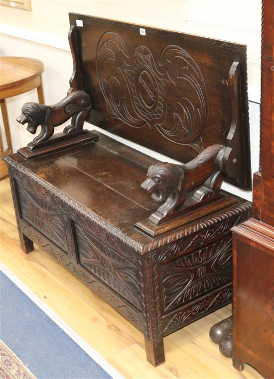 A Victorian oak box seat settle W.107cm